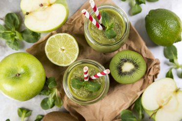 Two glasses of green smoothie and ingredients - JUNF00862