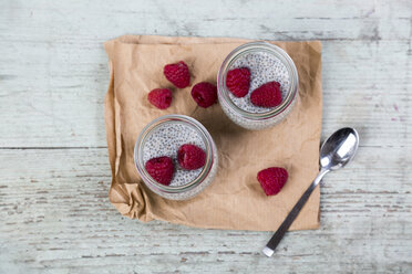 Glass of chia pudding with soya vanilla milk and raspberries - JUNF00873