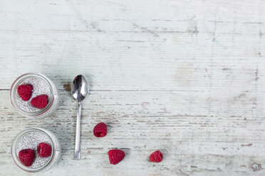 Glass of chia pudding with soya vanilla milk and raspberries - JUNF00875