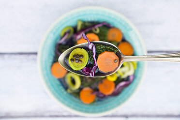 Spoon of vegan cabbage stew with lentils on wood - LVF05883