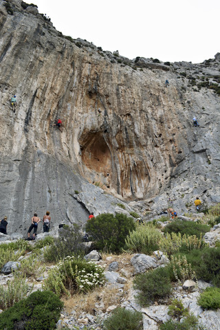 Greece, Kalymnos, climbers in rock wall stock photo