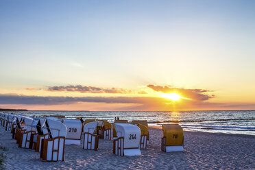 Germany, Zingst, hooded beach chairs at dawn - PUF00590