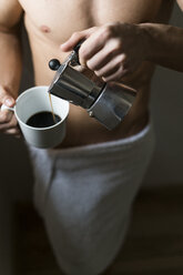 Attractive young amn with six pack drinking coffee - KKAF00480