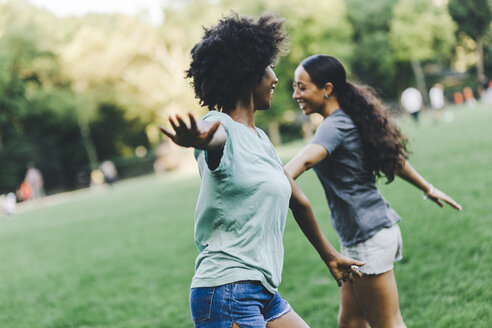 Two best friends having fun together in the park at evening - GIOF01978