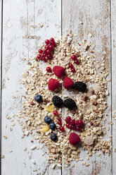 Granola with various wild berries on wood - CSF27921