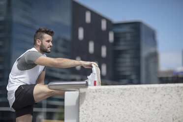 Athlete stretching in the city - ZEF12913