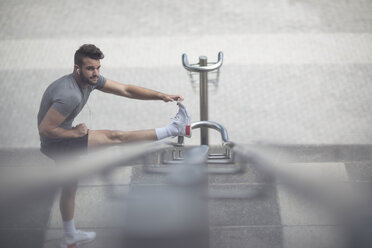 Athlete stretching in the city - ZEF12914