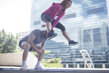 Couple exercising in the city - ZEF12936