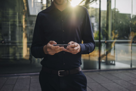 Businessman using futuristic portable device stock photo