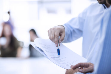 Businessman pointing with pen on contract - ZEF12987