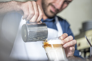 Barista preparing Latte Macchiato - ZEF12997