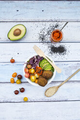 Lunch bowls of leaf salad, red cabbage, avocado, tomatoes, quinoa fritters and ajvar - LVF05902