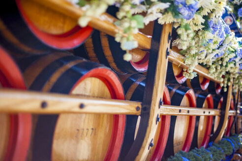 Germany, Bavaria, Munich, wooden barrels on cart at Oktoberfest - MMAF00045