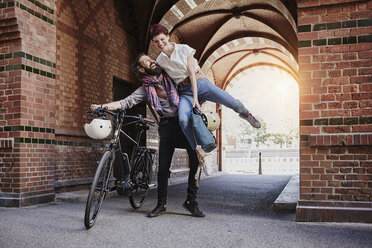 Happy couple with electric bicycle - RORF00653