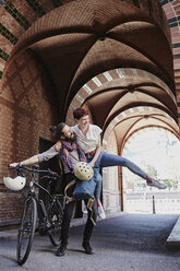 Happy couple with electric bicycle - RORF00654