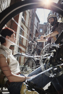 Couple with electric bicycles at backlight - RORF00669