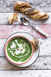 Bowl of spinach soup with chilipods and almonds - SARF03211