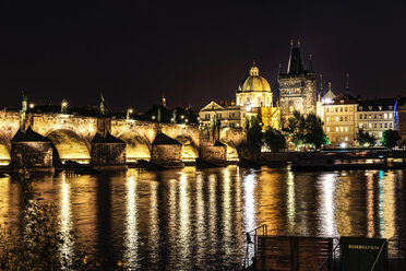 Czechia, Prague, view to lighted Charles Bridge and Old Town Bridge Tower at night - CSTF01313