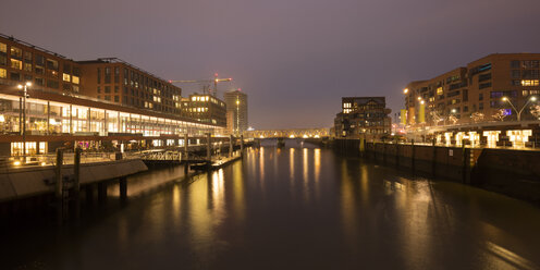 Germany, Hamburg, HafenCity, Elbarkaden and Elbtorpromenade at Magdeburger Hafen by twilight - WIF03407