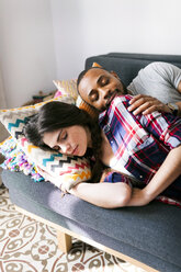 Young couple taking a nap on the sofa - VABF01211