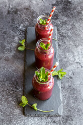 Beet root smoothie in glasses garnished with fresh mint - SARF03244