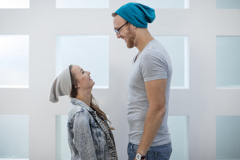 Short woman and tall man laughing at each other - ZEF13101