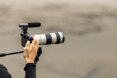 Close-up of photographer with camera - KNTF00677