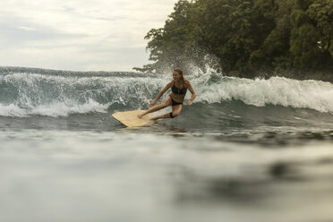 Indonesia, Java, happy woman surfing - KNTF00702