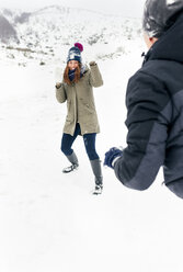 Friens having a snowball fight in the snow - MGOF03039