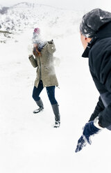 Friens having a snowball fight in the snow - MGOF03040