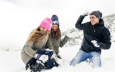 Friens having a snowball fight in the snow - MGOF03047