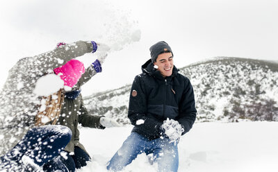 Friens having a snowball fight in the snow - MGOF03048