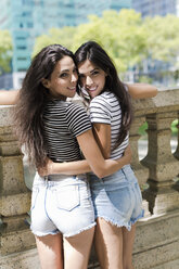 Portrait of two smiling twin sisters - GIOF02210