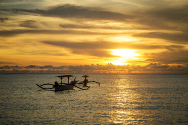 Indonesia, Bali, sunset over the ocean with boats - KNTF00742