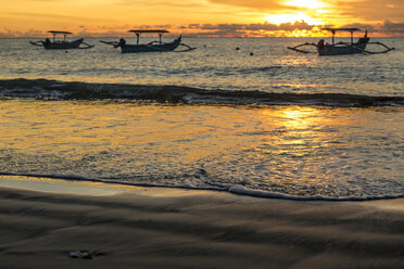 Indonesia, Bali, sunset over the ocean with boats - KNTF00743