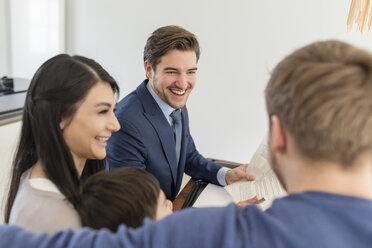 Happy consultant talking to family at home - SHKF00747