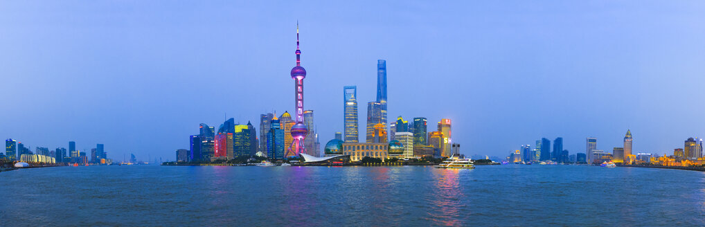 China, Shanghai, panoramic view of Pudong skyline with Huangpu River in the foreground at twilight - EAF00014