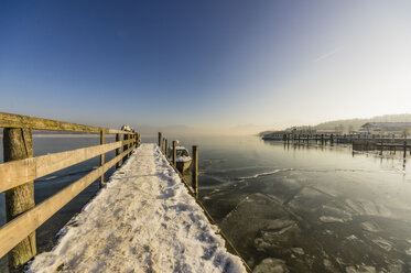 Germany, Bavaria, jetty at Chiemsee in winter - THAF01909