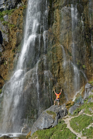 Austria, Tyrol, Rofan Mountains, hiker at Dalfaz waterfall stock photo