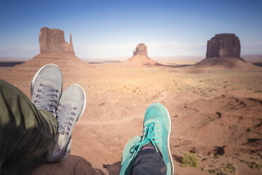 USA, Utah, feet of couple resting at Monument Valley - EPF00394