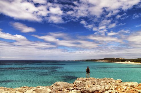 Spain, Menorca, Son Bou, man at the coast - SMAF00707