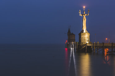 Germany, Baden-Wuerttemberg, Constance, harbor entrance with Statue Imperia in early morning - KEBF00541