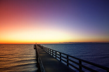 Germany, Boltenhagen, sea bridge at sunrise - PUF00596