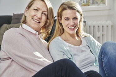Portrait of smiling adult daughter and mother - FMKF03614