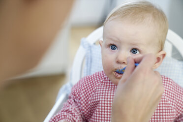 Baby girl being fed - FMKF03640