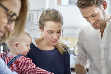 Family in kitchen looking down - FMKF03644