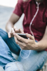 Close-up of man using cell phone - GIOF02407