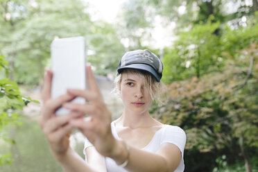 Young woman taking a selfie in park - BOYF00734