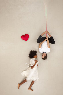 Couple falling in love, man hanging upside down - BAEF01267
