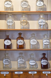 Germany, Radolfzell, shelves with glass bottles of historical pharmacy at municipal museum - SHF01958